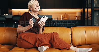 Buy stock photo Excited, woman and phone in home with credit card, online shopping payment and discount for purchase. Happy, mature person and digital banking in house with fintech, ecommerce website and savings.