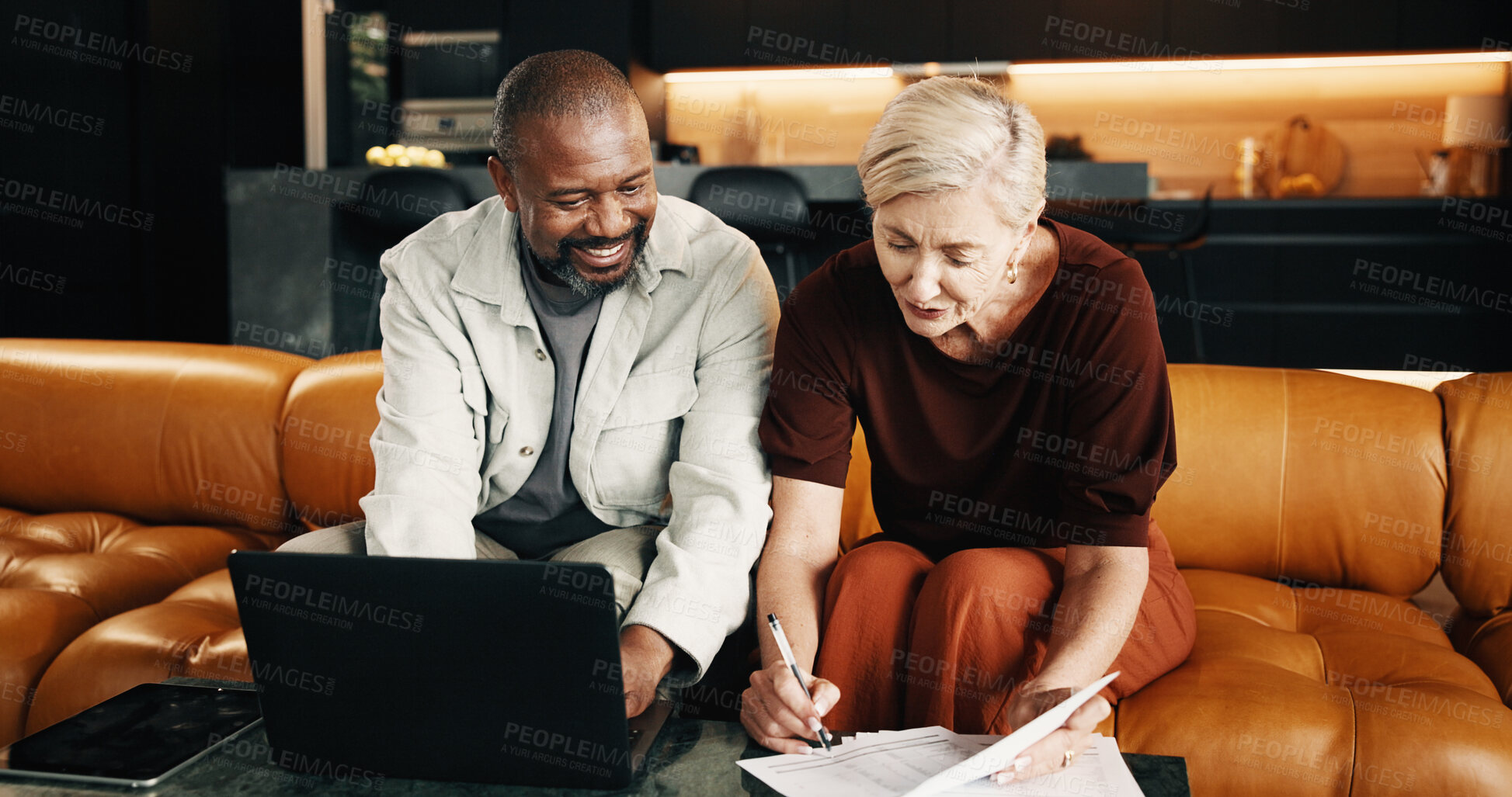 Buy stock photo Interracial couple, laptop and signature with documents in home for mortgage, bills or investment. Sign, mature people and paperwork with tech for financial planning, budget expenses or loan together