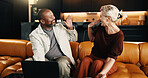 Interracial couple, laptop and smile with high five in home for mortgage, bills or investment. Mature man, woman and celebration with tech for financial planning, budget expenses or loan together