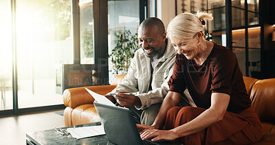 Buy stock photo Interracial couple, laptop and smile with document in house for mortgage, bills or investment. Mature man, woman and paperwork with tech for financial planning, budget expenses or invoices together