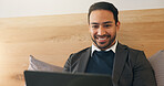 Business, man and smile in bedroom with laptop, social media and browsing website to unwind. Happy, corporate and male person at house with tech, streaming movies and watching video for weekend break