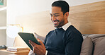 Smile, businessman and relax in bedroom with tablet, social media and browsing website to unwind. Happy, corporate and person in home with digital, streaming movies and comedy video for weekend break