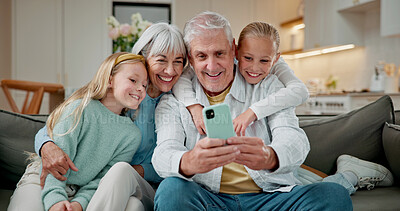 Buy stock photo Selfie, smile and grandparents with children on sofa in home for love, social media post and digital memory. Photography, support and visit with senior man and woman with kids in living room in house