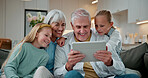 Tablet, smile and grandparents with children on sofa in home for love, social media and connection. Online post, support and visit with senior man and woman with kids in living room in house