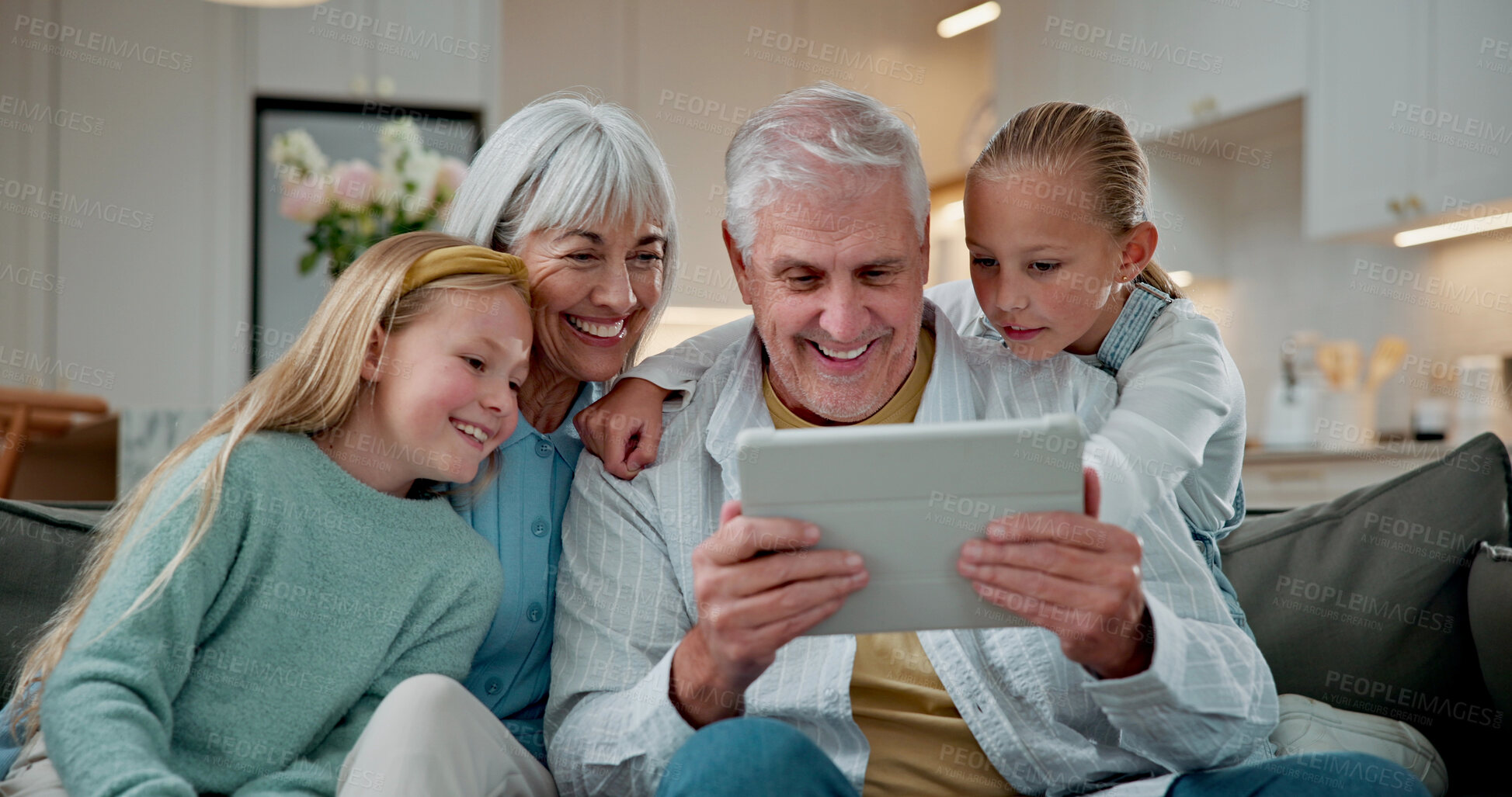 Buy stock photo Tablet, smile and grandparents with children on sofa in home for love, social media and connection. Online post, support and visit with senior man and woman with kids in living room in house