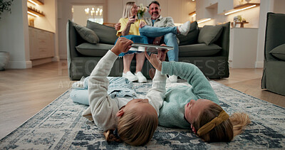 Buy stock photo Tablet, relax and children on floor in home for watching movie, series or video on app together. Happy, digital technology and girl kids streaming show online for subscription service on weekend.