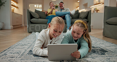 Buy stock photo Tablet, smile and children on floor in home for watching movie, series or video on app together. Happy, digital technology and girl kids streaming show online for subscription service on weekend.