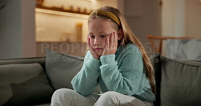 Buy stock photo Sad, child and thinking in home with loneliness, boredom and mental health crisis in lounge. Thoughts, emotional and kid with depression, overthinking and sorrow expression for bad memories on couch