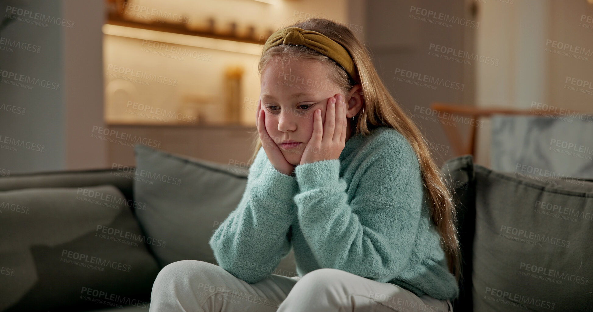 Buy stock photo Sad, child and thinking in home with loneliness, boredom and mental health crisis in lounge. Thoughts, emotional and kid with depression, overthinking and sorrow expression for bad memories on couch
