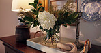 Flower, decor and home with dressing table for interior design, floral or garden style. Empty, surface and tray with natural plant, light or ornaments for hospitality or furniture in luxury hotel.