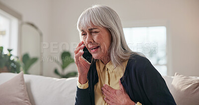 Buy stock photo Senior, woman and sofa with phone call for heart ache, disease or medical emergency in home. Sad, female person or elderly patient with sore chest on smartphone for Telehealth advice or conversation
