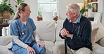 Caregiver, talking and old man in home with walking stick, support and medical advice for recovery. Smile, nurse and senior person with disability, assisted living and discussion for rehabilitation