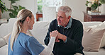 Caregiver, comfort and old man in home with walking stick, support and empathy for recovery. Smile, nurse and consoling senior person with disability, assisted living and sympathy for rehabilitation