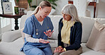 Nurse, home and senior woman with tablet, online diagnosis and consulting for medical service. Talking, healthcare and caregiver with elderly person on tech for support, wellness report and insurance
