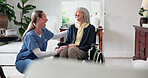 Caregiver, comfort and home with old woman in wheelchair, support and empathy for recovery. Nurse, laugh and consoling senior person with disability, assisted living and sympathy for rehabilitation