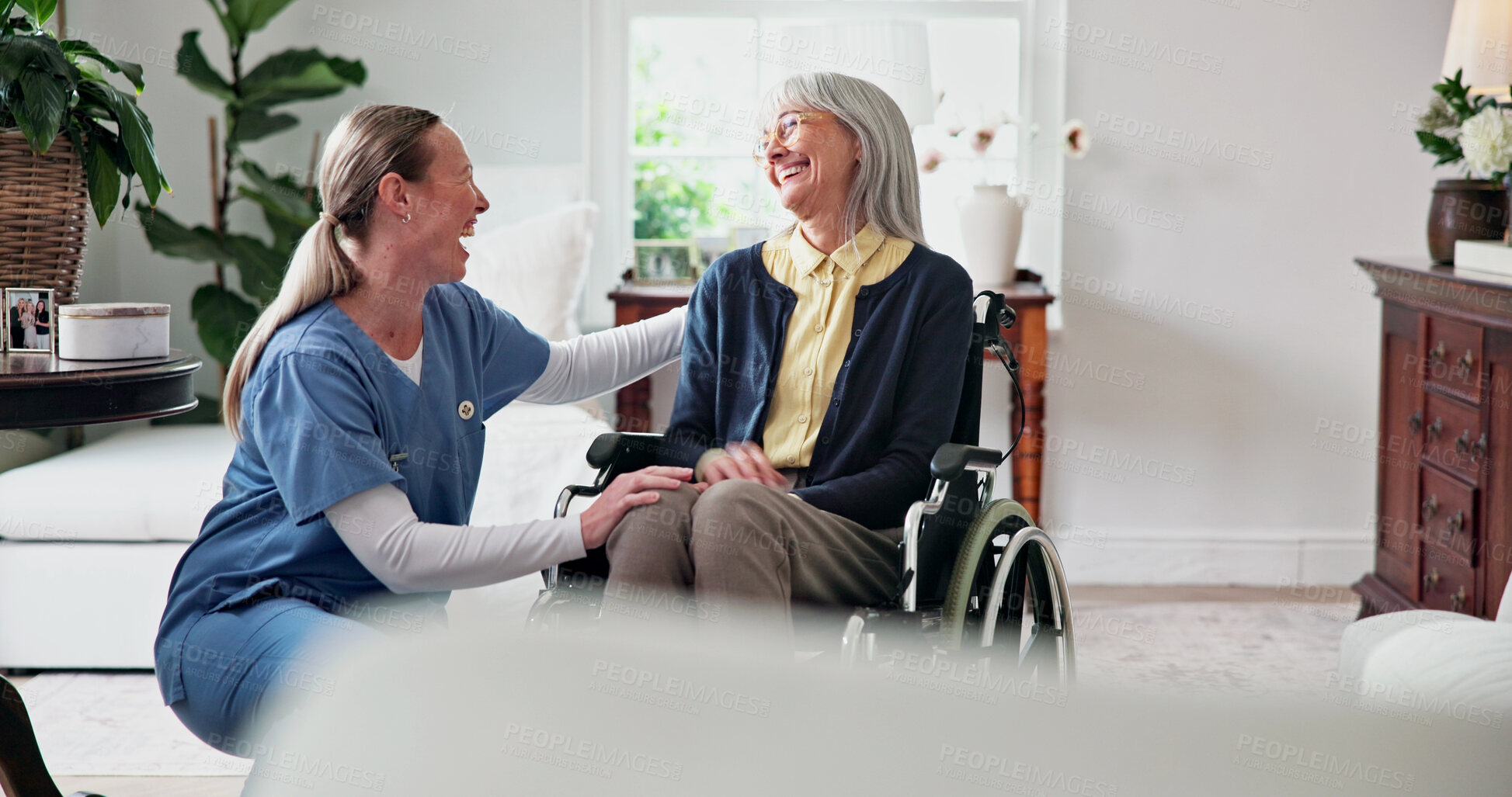 Buy stock photo Caregiver, comfort and home with old woman in wheelchair, support and empathy for recovery. Nurse, laugh and consoling senior person with disability, assisted living and sympathy for rehabilitation