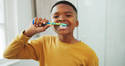 Buy stock photo Dental health, portrait and black child brushing teeth in bathroom for hygiene, wellness or morning. Toothbrush, oral care and boy kid with clean mouth for fresh breath or grooming routine in house.