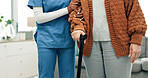Senior, woman and caregiver hands with cane, support or assistance for rehabilitation in nursing home. Nurse, help and elderly person with disability, walking stick and injury recovery in retirement.
