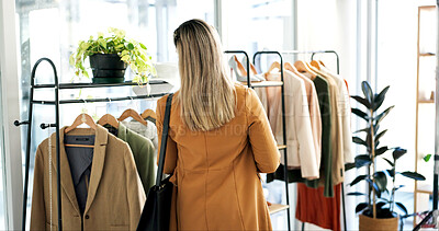 Buy stock photo Back, clothes and woman in boutique, choice and shopping with retail therapy, fabric quality and fashion. Customer, luxury design and person in store, discount deal and sale for product and textile