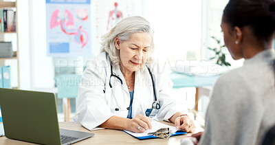 Buy stock photo Doctor, writing and meeting with patient, healthcare and explain medical diagnosis and test results. Mature person, notes and health professional with clipboard, wellness and appointment in hospital