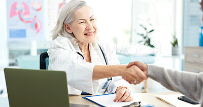 Buy stock photo Healthcare doctor and handshake with patient in hospital, greeting and happy woman with test results. Mature person, smile and health professional with clipboard, wellness and shaking hands in clinic
