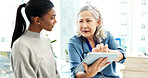 Doctor, discussion and women with tablet, healthcare and explain medical diagnosis and test results. People, online and health professional with tech, consultation and wellness appointment in clinic