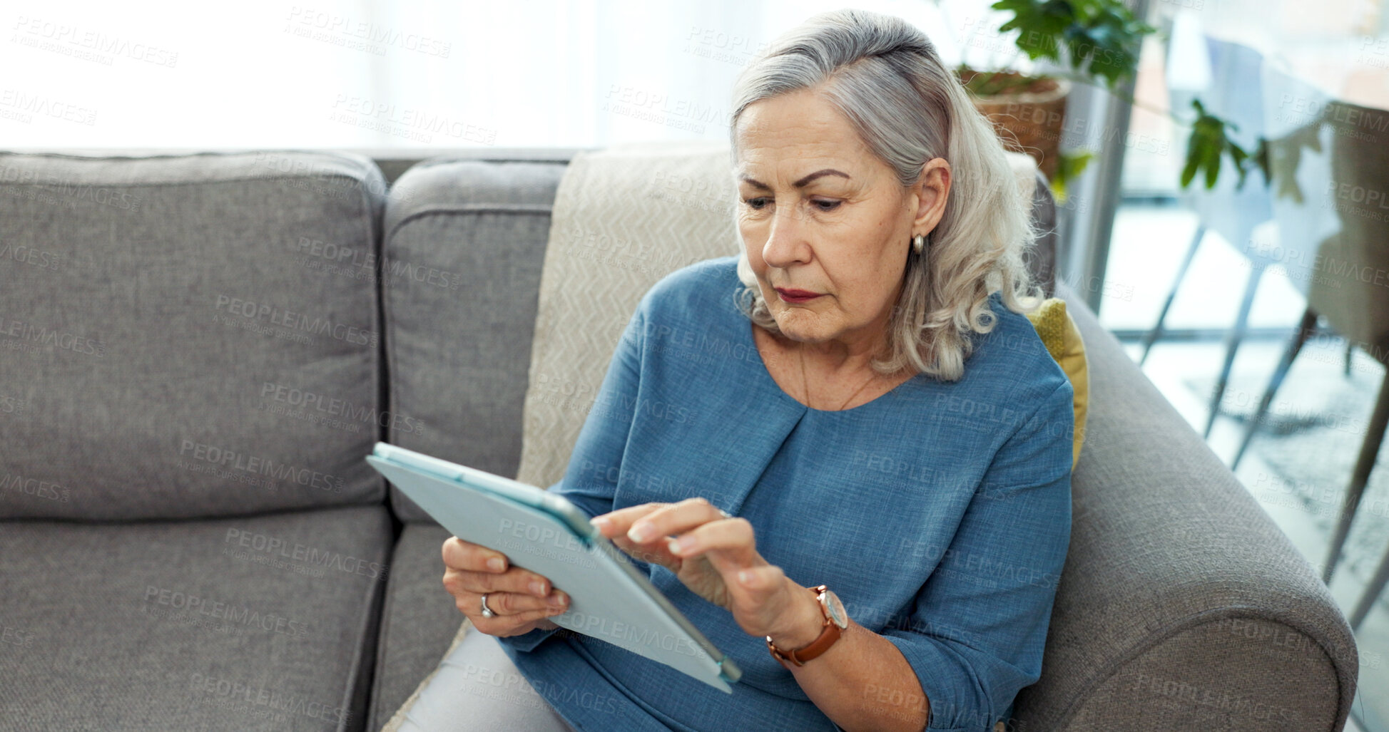 Buy stock photo Tablet, relax and senior woman on sofa in home with reading blog on pension funds, savings or finance. Digital technology, online and elderly female person with retirement planning in living room.