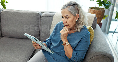 Buy stock photo Tablet, thinking and senior woman on sofa in home with reading blog on pension funds, savings or finance. Digital technology, decision and elderly female person with retirement plan in living room.