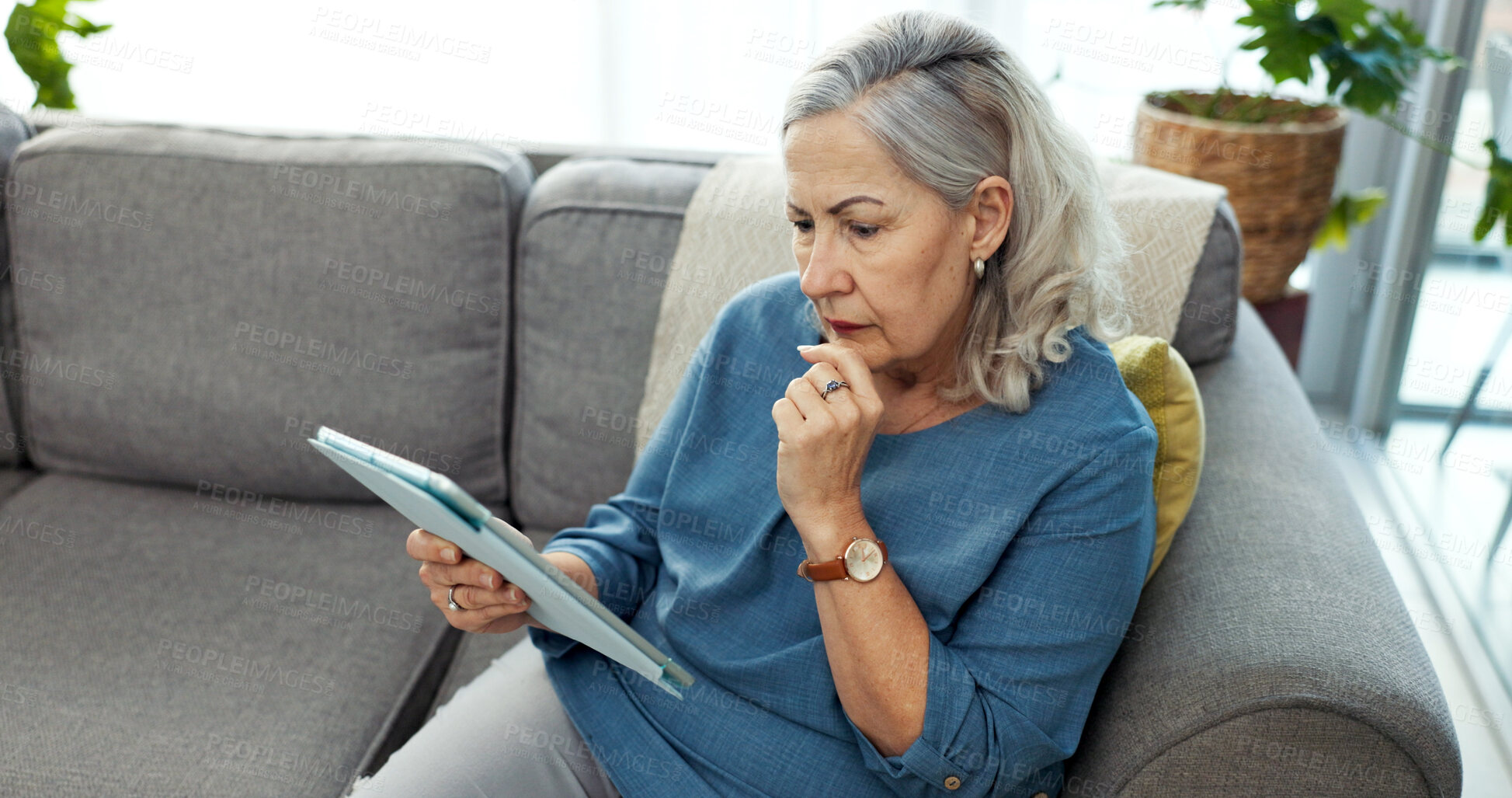 Buy stock photo Tablet, thinking and senior woman on sofa in home with reading blog on pension funds, savings or finance. Digital technology, decision and elderly female person with retirement plan in living room.