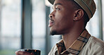 Black man, coffee and thinking in cafe for memory, drink and relax with inspiration at restaurant. Person, daydreaming and cup with reflection, remember and perspective with beverage at diner
