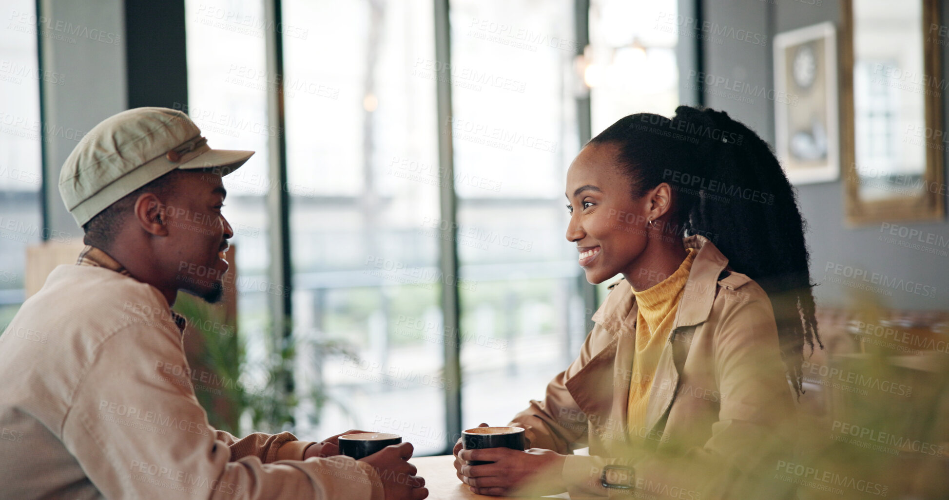 Buy stock photo Couple, happy and conversation in coffee shop for date, bonding and together for love, care and trust. Black man, woman and drink in cafe with communication, chat or catch up for healthy relationship