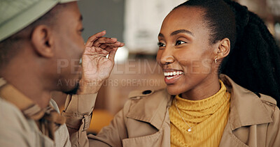 Buy stock photo Talking, smile and black couple in home, love and bonding together for care, relax and funny. Laughing, man and woman in lounge, happiness or healthy relationship with marriage, romance or discussion