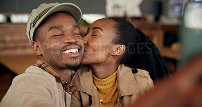 Buy stock photo Love, black couple and kiss selfie in cafe for romantic date memory, social media post and bonding. Photo, happy people and affection in coffee shop for healthy relationship, status update or support