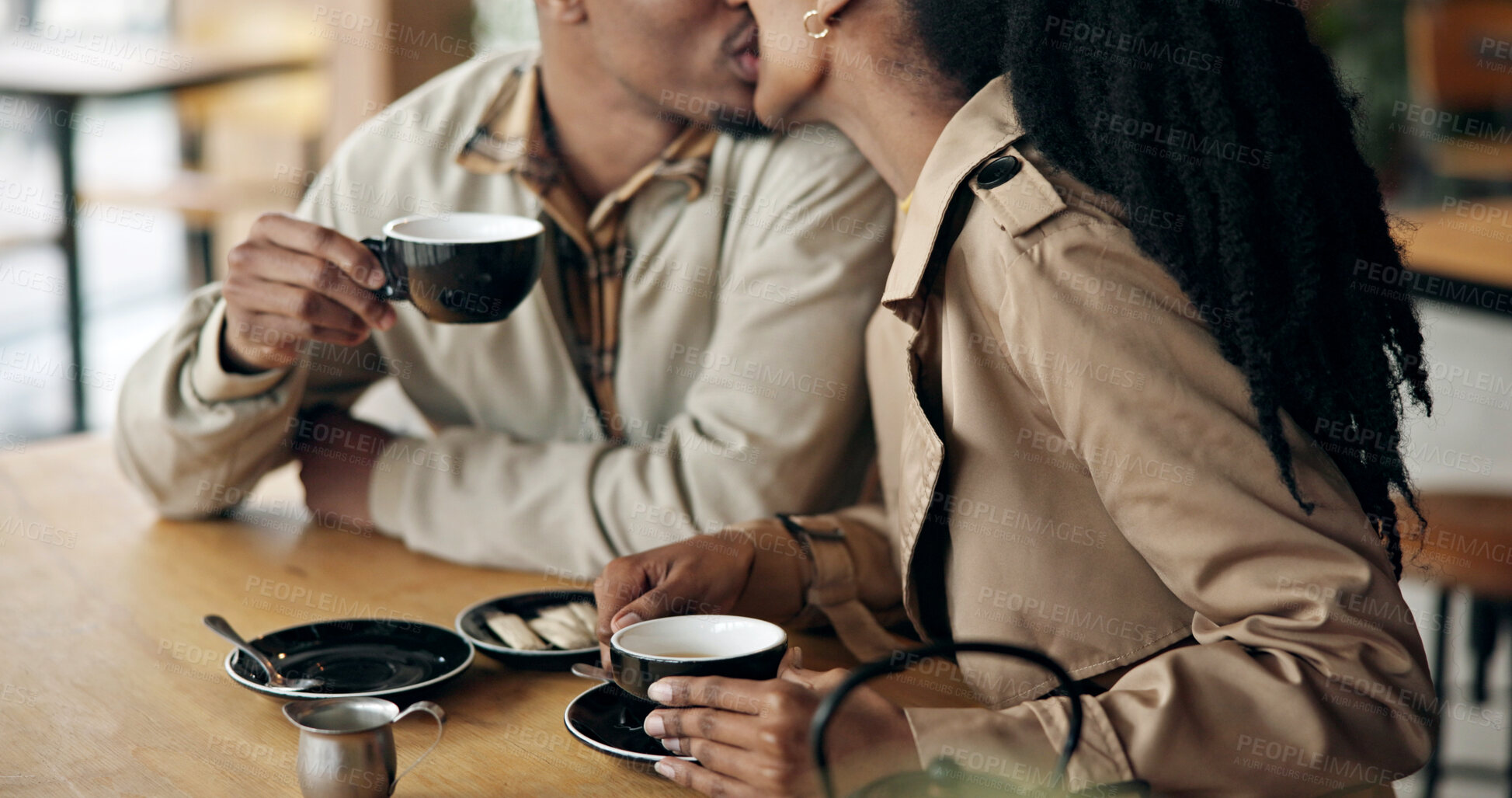 Buy stock photo Couple, relax and coffee at cafe with kiss, love and partner affection for bonding together. Black people, romance and care at store with beverage, healthy relationship and connection for commitment