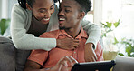 Couple, online and laughing with tablet in home, entertainment or streaming video with subscription. Black people, scroll and happy with partner on couch, bonding and watching funny movie with tech