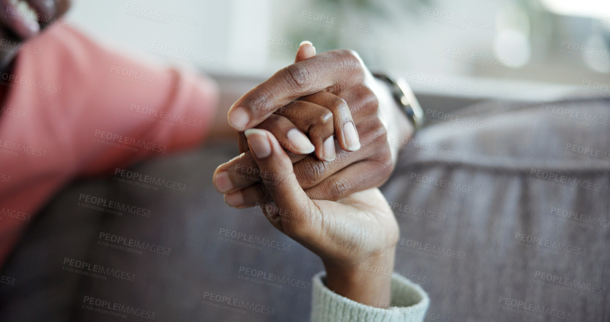 Buy stock photo Couple, holding hands and bonding on couch, home and connection with partner on break or commitment. People, love and affection for spouse, comfort and support with gesture on weekend and romance