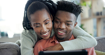 Buy stock photo Couple, hug and relax with tablet in lounge, entertainment and streaming film with app subscription. Black people, online and happy with partner on couch, bonding and watching movie with tech in home