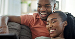 Laughing, couple and relax with tablet on couch, entertainment and streaming film with subscription. Black people, online and happy with partner in home, bonding and watching funny movie with tech