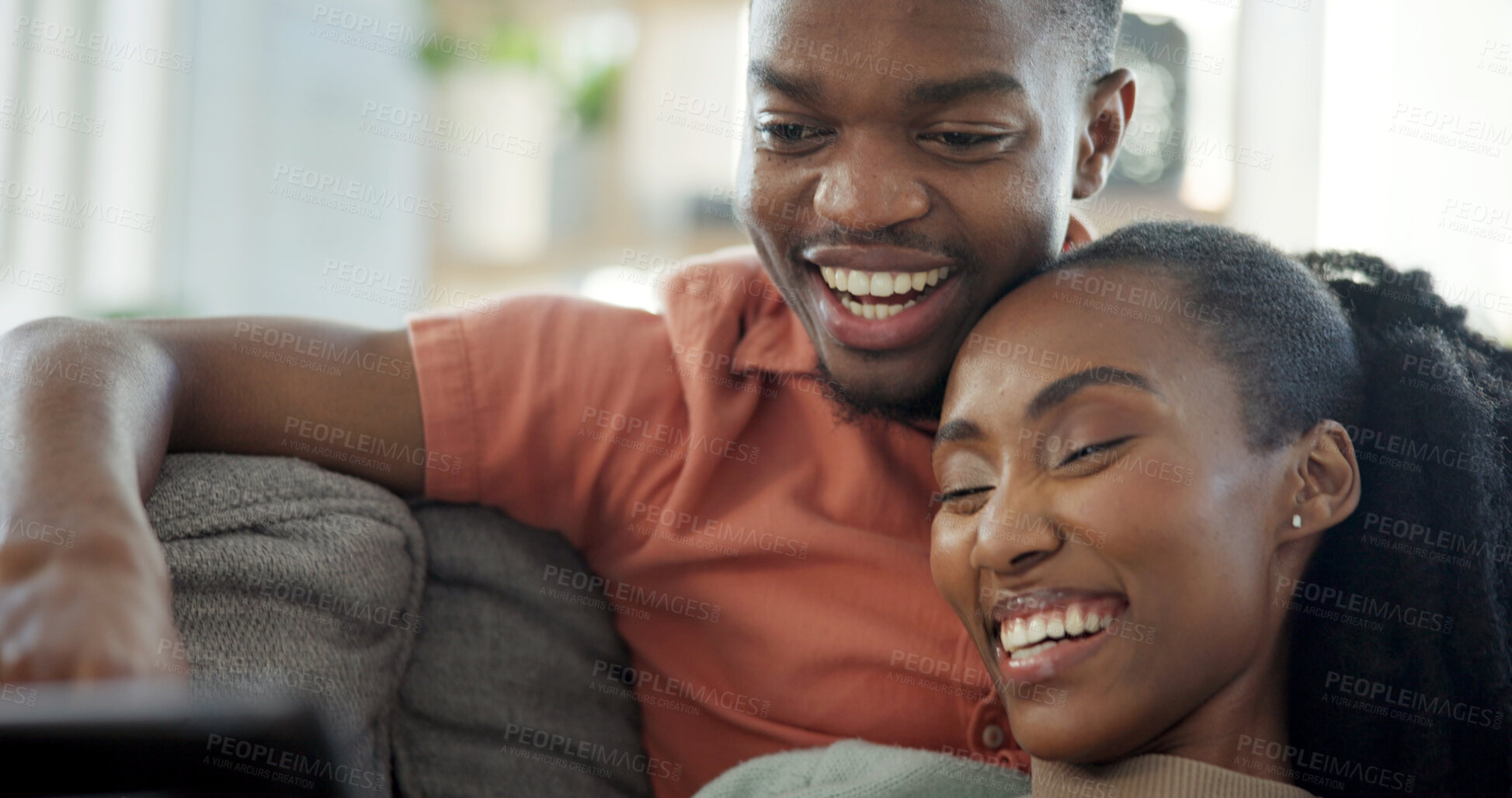 Buy stock photo Laughing, couple and relax with tablet on couch, entertainment and streaming film with subscription. Black people, online and happy with partner in home, bonding and watching funny movie with tech