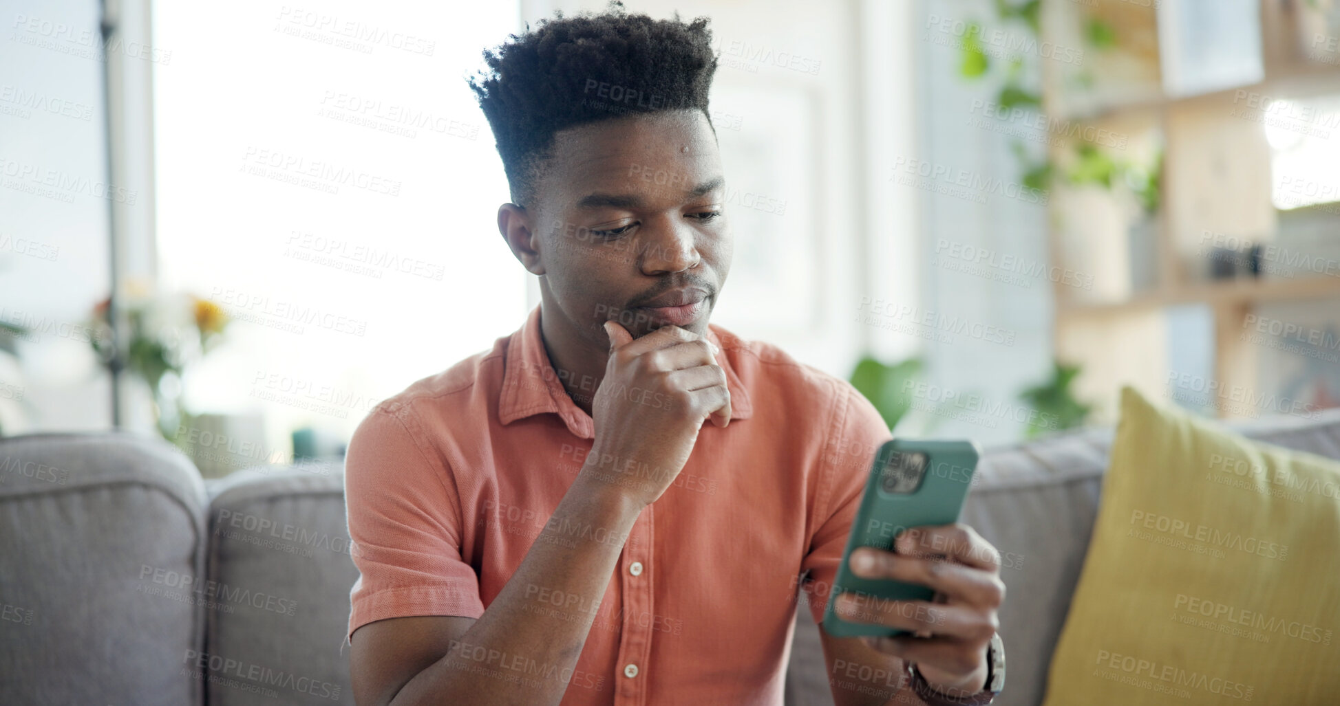 Buy stock photo Thinking, phone and black man on sofa in home with networking, connection or texting on mobile app. Relax, decision and African male person with cellphone for chatting, communication or social media.