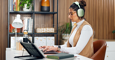Buy stock photo Woman, headphones and accountant with laptop, online and financial report on web or budget analysis. Typing, info and person with tech for music, paperwork and bookkeeping with research in office