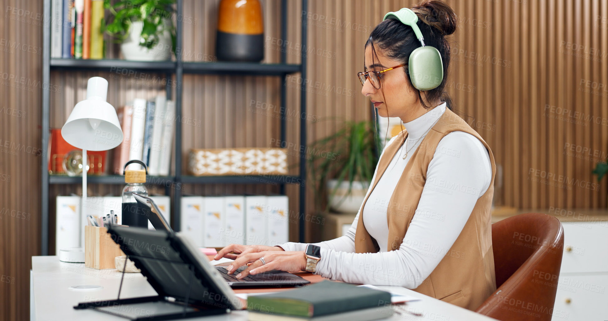 Buy stock photo Woman, headphones and accountant with laptop, online and financial report on web or budget analysis. Typing, info and person with tech for music, paperwork and bookkeeping with research in office