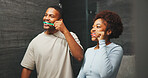 Dental, love and couple in mirror with toothbrush, mouth wellness or bonding with oral care. Dentistry, grooming or people in home with tool, teeth whitening or hygiene routine in romantic connection