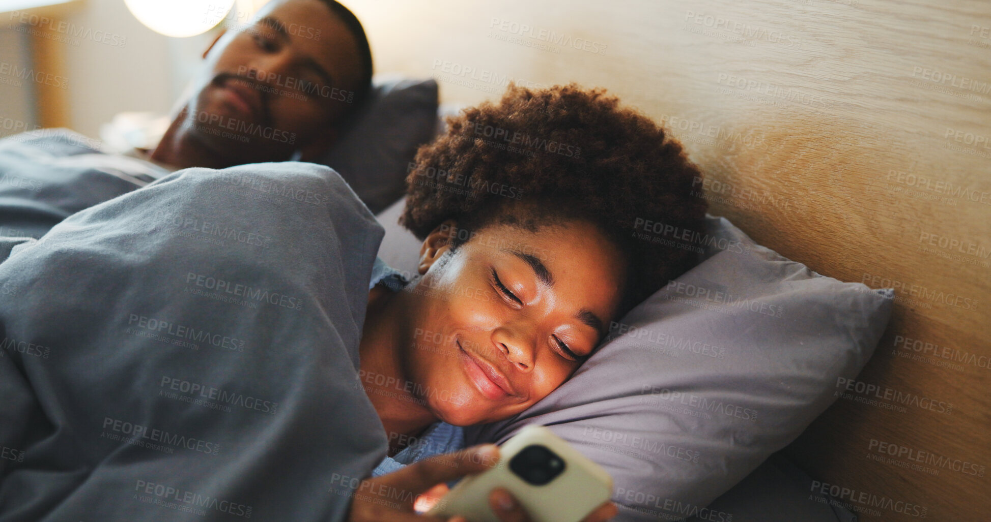 Buy stock photo Phone, couple and woman in bedroom with addiction, jealous man and browsing social media. Ignore, mobile and African people in bed at home with attention problem, relationship neglect or text message