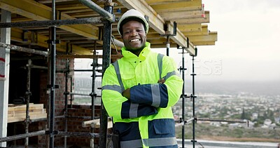 Buy stock photo Crossed arms, black man and portrait of construction worker on site with confidence for renovation. Happy, scaffolding and male civil engineer with pride for infrastructure, building or repairs.