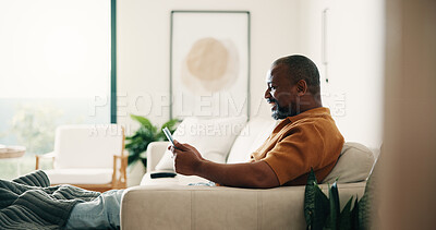 Buy stock photo Happy, relax and black man with tablet on sofa for entertainment or online subscription in home. Male person, chilling and smile with technology on couch for movie, series or streaming app in house