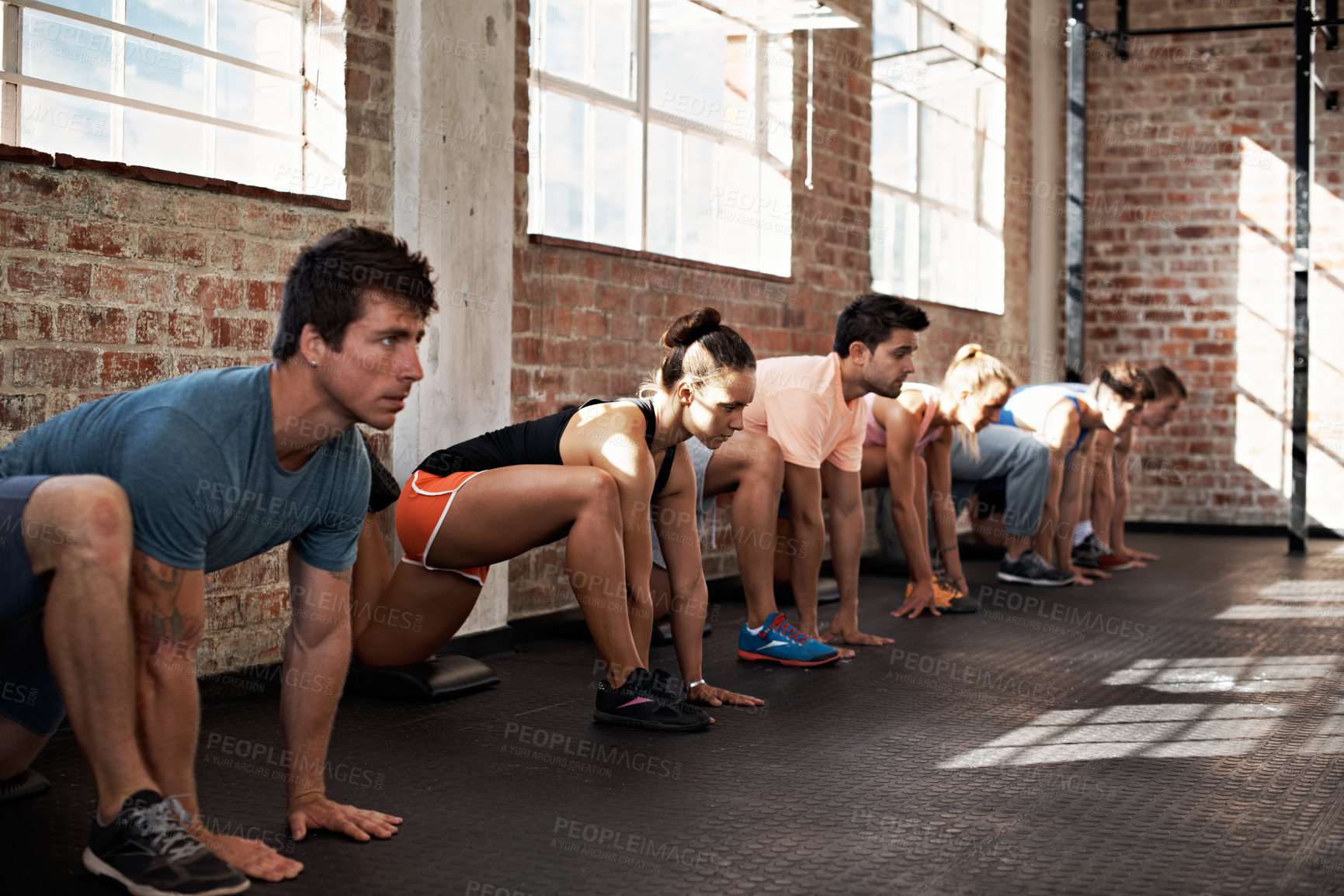 Buy stock photo Sports, lunge and people at workout class in gym for muscle training, active or wellness on weekend. Health, stretching and group of athletes with leg exercise, balance or challenge in fitness center