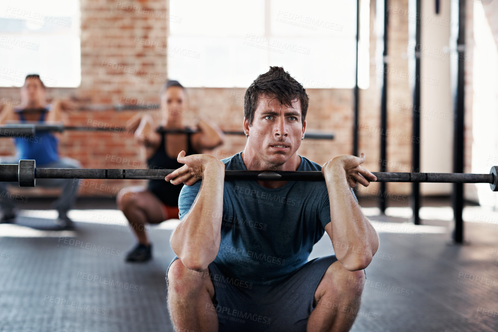 Buy stock photo Fitness, class and man with barbell in gym, endurance or bodybuilding routine for muscle development. Health club, athlete and people with equipment for wellness, training and exercise with balance