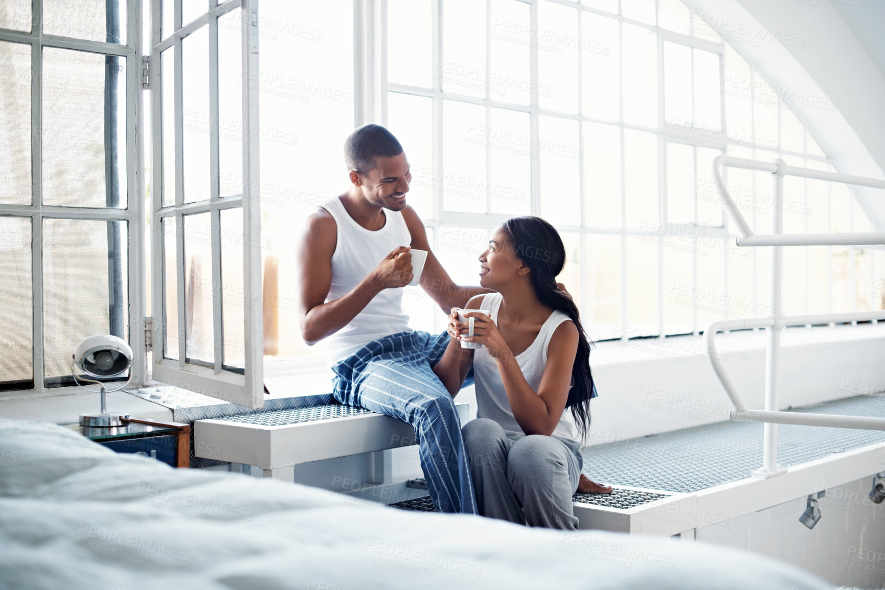 Buy stock photo Talking, window and couple with coffee in home for bonding, conversation and relationship. Happy, house and man with woman for connection, communication and drink for love, trust and chat on weekend