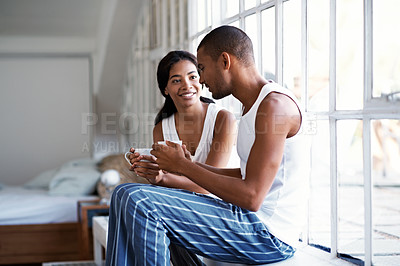 Buy stock photo Cropped shot of a young couple enjoying their morning at home